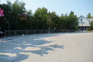 Parking lot leading to a gray building, Grant Hall.