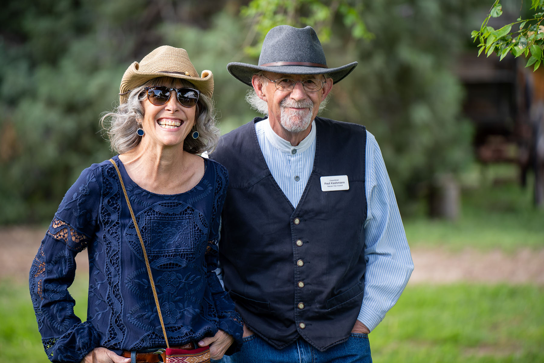 Two people smiling outdoors, Paul Krabmann name tag visible