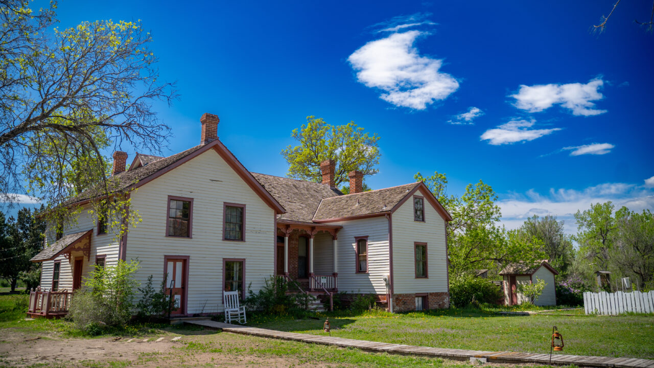 Historic house in Four Mile Park under clear blue sky